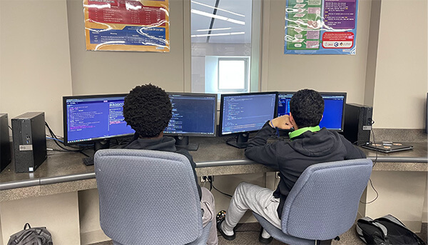 students coding a project