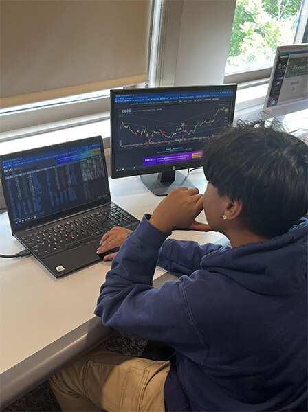 student checking stocks
